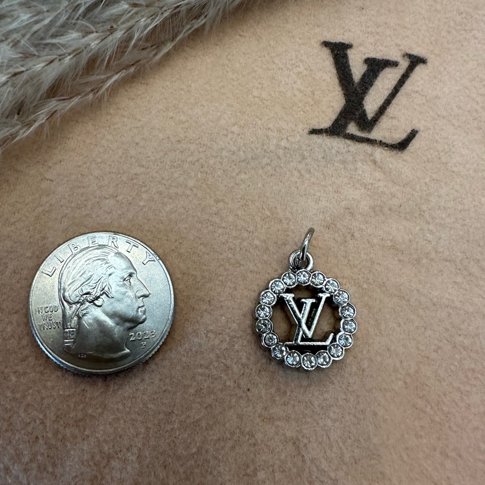 (SOLD)🔥💯Authentic “RARE” Silver LV charm🔥